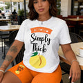 Peach Letter Print Short-Sleeved Shorts Set in a Loose White T-Shirt and an Orange Tight Short Pants Casual Outfit