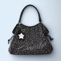 BadBlue, a Korean brand known for its niche, forest-inspired leopard print dot pattern, business-ready bag with a trendy, sweet-