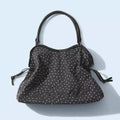 BadBlue, a Korean brand known for its niche, forest-inspired leopard print dot pattern, business-ready bag with a trendy, sweet-