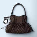 BadBlue, a Korean brand known for its niche, forest-inspired leopard print dot pattern, business-ready bag with a trendy, sweet-